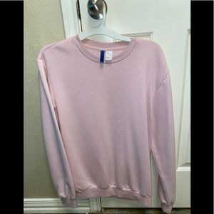 Divided light pink sweater/pullover, size Small, cotton(60%) and Polyester(40%).